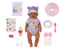 Baby doll with accessories on a white background