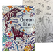 Ocean life coloring book with colorful illustrations on one side and black and white patterns on the other.