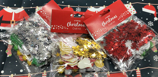 Christmas craft kit with decorative items on a black background