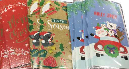Set of Christmas-themed notebooks with colorful designs on a white background
