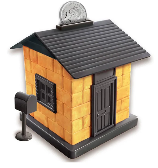 Small model of a house with a coin on top, set against a white background