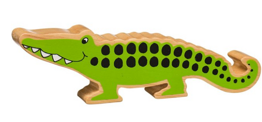 Wooden toy alligator with green body and brown top, on a white background
