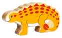 Wooden toy dinosaur with a yellow body and red spots on a white background