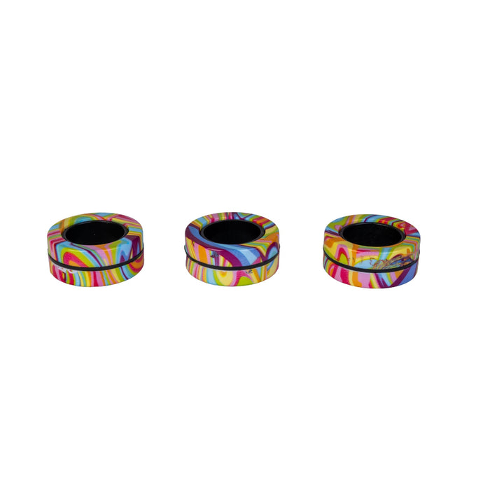Three colorful circular objects with a tie-dye pattern on a white background