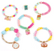 Set of colorful beaded bracelets with charms on a white background