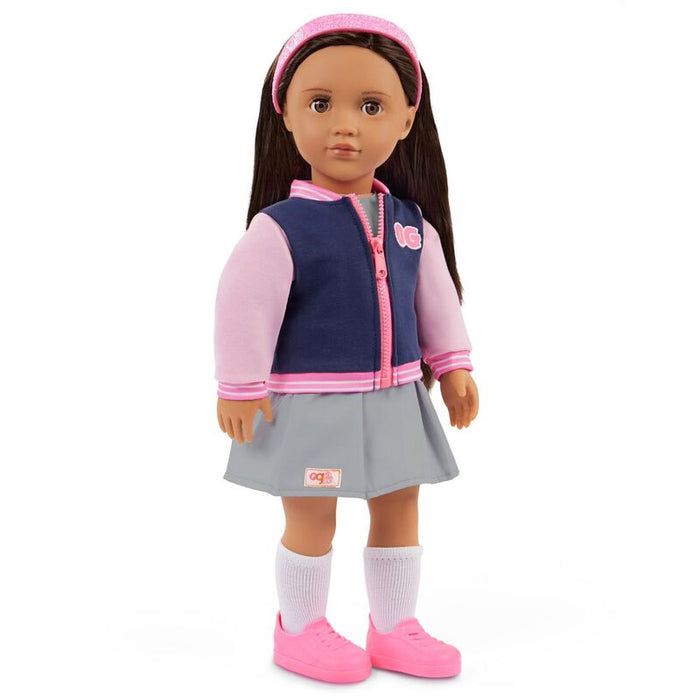 Doll wearing a pink and navy jacket with a gray skirt on a white background