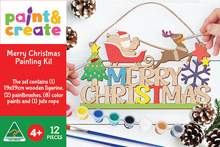 Christmas painting kit with wooden figure, paintbrushes, and paints on a white background