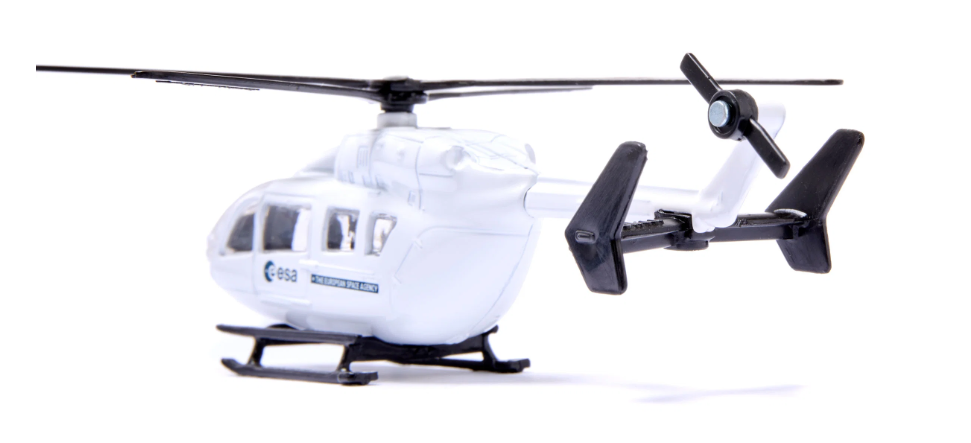 White helicopter model with black propellers on a white background
