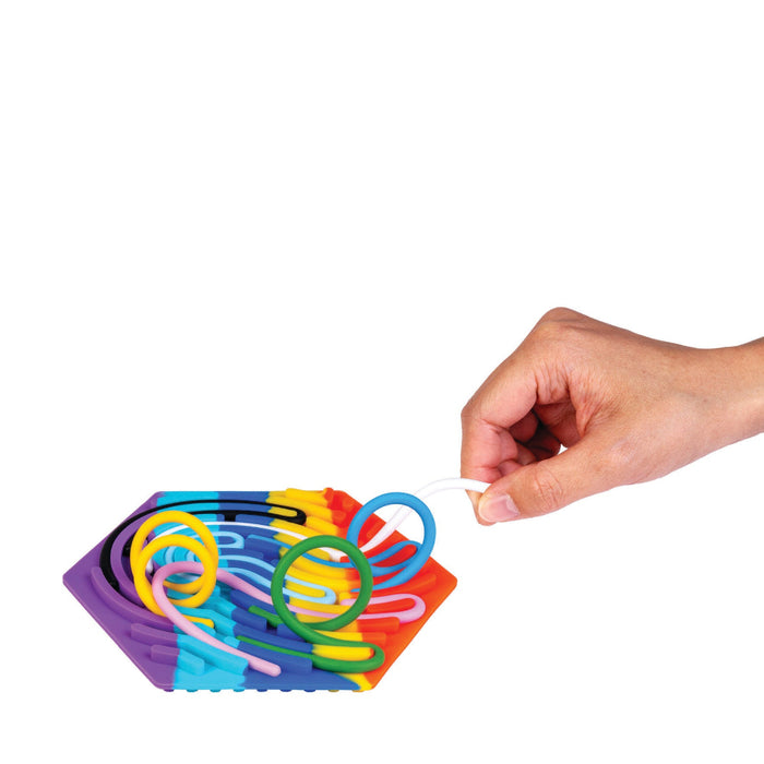 Colorful spiral spring toy with a hand interacting with it on a white background