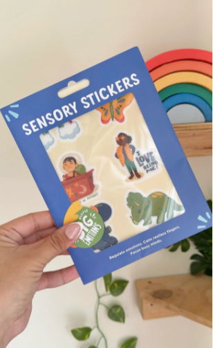Pack of sensory stickers held by a hand with a blurred background