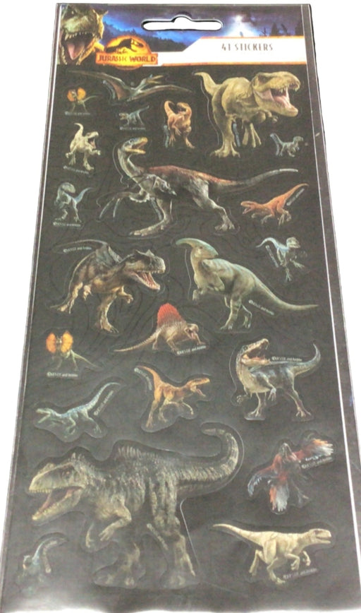 Sheet of dinosaur stickers on a black surface with another sheet of Barbie stickers partially visible.