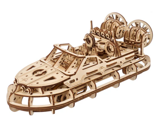 Wooden model of a mechanical vehicle on a white background