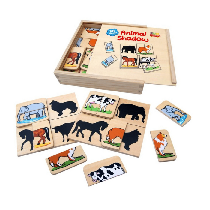 Wooden animal shadow matching game with pieces and box on a white background