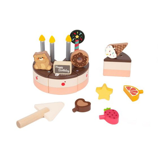 Toy birthday cake set with candles, slices, and accessories on a white background