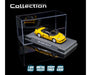 Yellow model car in a clear display case with branding and product details.
