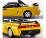 Yellow toy car model with black roof and NSX-R branding on a white background