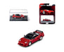 Red car model with packaging and display case on a white background