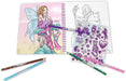 Coloring book with fairy illustration, pencils, and stickers on a white background